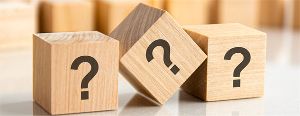 Wooden blocks with question marks